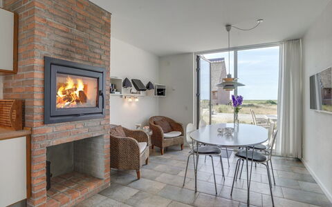 Helgo - 250M from the Sea: Wood, Flooring, Furniture, Brick, Floor, Hearth, Brickwork, Living Room, Chair, Wood Stain
