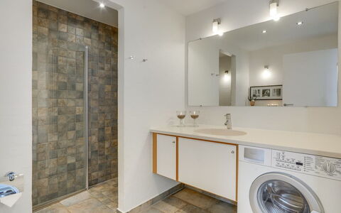 Helgo - 250M from the Sea: Flooring, Interior Design, Wall, Floor, Plumbing Fixture, Ceiling, Bathroom Cabinet, Light Fixture, Bathroom, Lighting