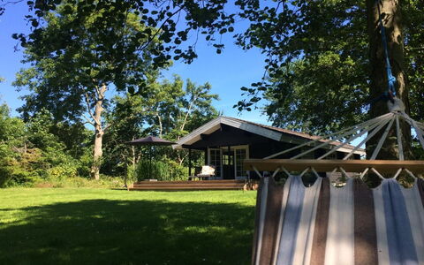Freyja - 800M from the Sea: Roof, House, Home, Cottage, Door, Siding, Deck, Porch, Plank, Hardwood