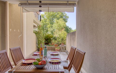 Le Stadium: Table, Furniture, Building, Plant, Chair, Wood, Shade, Interior Design, Outdoor Furniture, Window