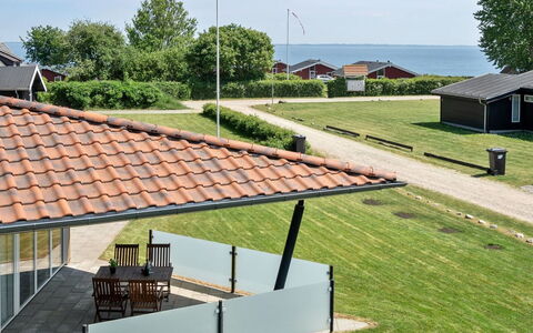Helena - 250M from the Sea: Roof, Home, Shade, Cottage, Porch, Estate, Lawn, Yard, Siding, Landscaping