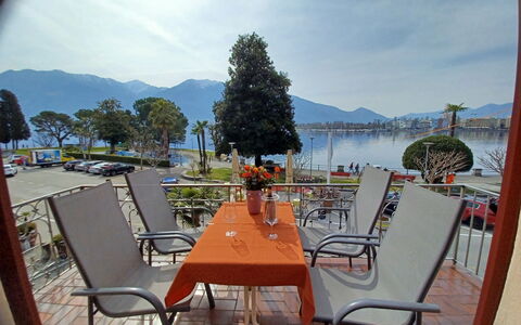 Vela da Reto: Sky, Table, Cloud, Furniture, Property, Chair, Water, Building, Outdoor Furniture, Outdoor Table