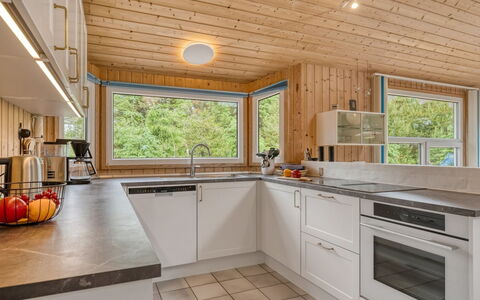 Heggi - 900M from the Sea: Kitchen, Countertop, Interior Design, Flooring, Kitchen Appliance, Wood, Ceiling, Major Appliance, Cabinetry, Floor
