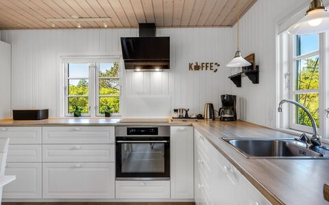 Soleil - 300M from the Sea: Kitchen, Flooring, Countertop, Wood, Interior Design, Kitchen Appliance, Cabinetry, Floor, Ceiling, Wood Flooring