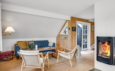 Christensen - 100M from the Sea: Furniture, Flooring, Wood, Interior Design, Chair, Floor, Living Room, Lighting, Room, Wood Flooring