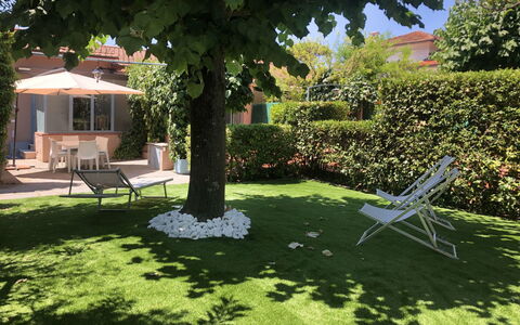 Villa Paola: Plant, Tree, Outdoor Furniture, Grass, Land Lot, Chair, Leisure, Shade, Landscape, Groundcover