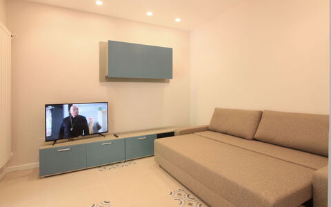 Villa Paola: Furniture, Property, Couch, Comfort, Building, Interior Design, Flooring, Television, Floor, Wall