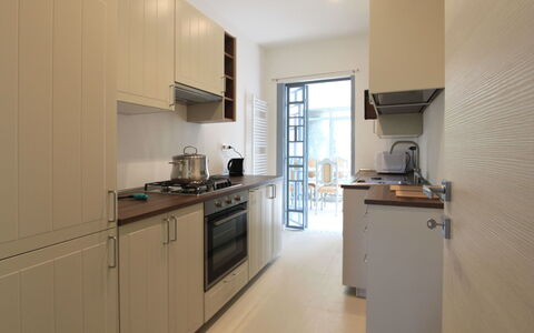 Villa Paola: Cabinetry, Property, Countertop, Kitchen Stove, Kitchen Appliance, Sink, Wood, Kitchen Sink, Home Appliance, Kitchen
