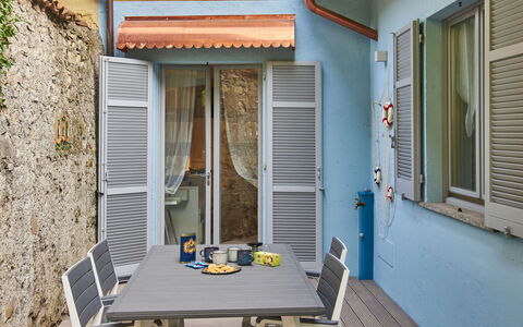 La Tana del Pescatore: Table, Building, Blue, Window, Wood, Orange, Door, Interior Design, Chair
