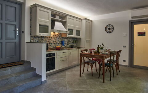 La Tana del Pescatore: Property, Picture Frame, Furniture, Table, Building, Wood, Door, Living Room, Houseplant, Interior Design