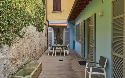 La Tana del Pescatore: Furniture, Building, Window, Plant, Wood, Chair, Flooring, Floor, Shade, Road Surface