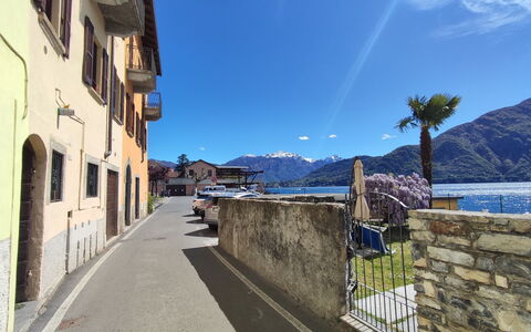 La Tana del Pescatore: Sky, Water, Building, Cloud, Window, Azure, Mountain, Plant, Wood, House