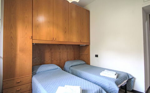Valle dei Poggi: Wood, Bedroom, Bed, Floor, Flooring, Interior Design, Bed Sheet, Furniture, Bedding, Room