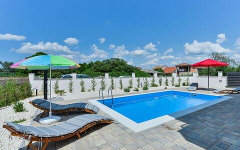 Sunset: Water, Sky, Cloud, Property, Swimming Pool, Azure, Sunlounger, Outdoor Furniture, Shade, Building