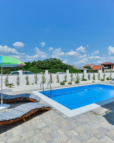 Sunset: Water, Sky, Cloud, Property, Swimming Pool, Azure, Sunlounger, Outdoor Furniture, Shade, Building