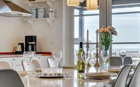 Miika - 100M from the Sea: Furniture, Interior Design, Light Fixture, Table, Chair, Lighting, Ceiling, Dining Room, Flooring, Tableware