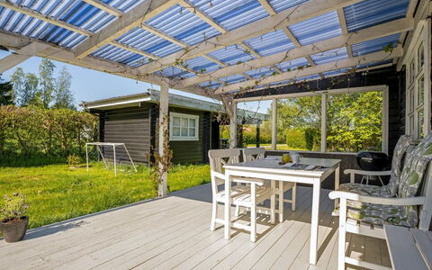 Lamberthus - 600M from the Sea: Wood, Porch, Roof, Shade, Deck, Outdoor Furniture, Garden, Outdoor Structure, Cottage, Chair