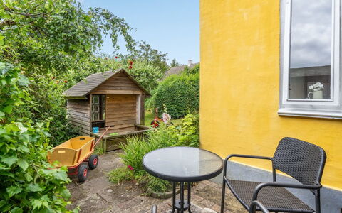 Gytta - 1Km from the Sea: Yellow, Shrub, Furniture, Land Lot, Garden, Door, Cottage, Outdoor Furniture, Chair, Backyard