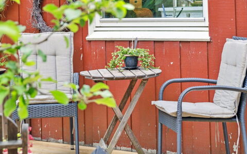 Reika - 1Km from the Sea: Furniture, Outdoor Furniture, Chair, Outdoor Table, Flowerpot, Wood Stain, Hardwood, Garden, Houseplant, Armrest