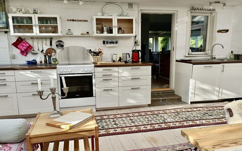 Lenard - 400M from the Sea: Furniture, Kitchen, Flooring, Interior Design, Cabinetry, Kitchen Appliance, Countertop, Floor, Wood, Major Appliance
