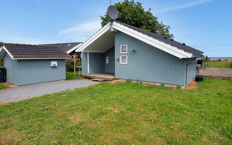 Hane - 150M from the Sea: Roof, House, Cottage, Home, Siding, Shed, Yard, Garden Buildings, Lawn, Backyard