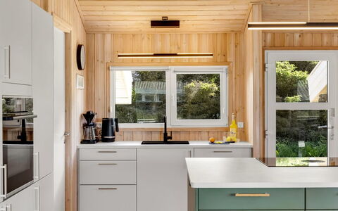 Ellen - 289M from the Sea: Kitchen Appliance, Kitchen, Countertop, Furniture, Major Appliance, Interior Design, Flooring, Cabinetry, Wood, Refrigerator