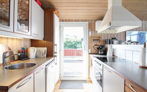 Diderik - 300M from the Sea: Kitchen, Countertop, Kitchen Appliance, Interior Design, Furniture, Flooring, Major Appliance, Wood, Cabinetry, Floor