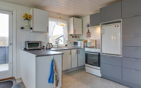 Edvin - 400M from the Sea: Kitchen, Major Appliance, Kitchen Appliance, Countertop, Flooring, Interior Design, Cabinetry, Furniture, Floor, Home