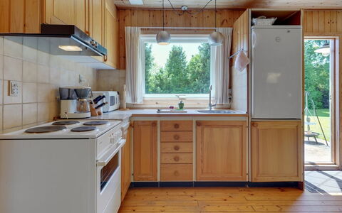 Hege - 450M from the Sea: Kitchen, Countertop, Kitchen Appliance, Flooring, Interior Design, Major Appliance, Wood, Cabinetry, Furniture, Kitchen Sink