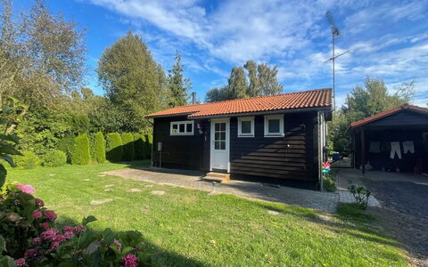 Undis - 660M from the Sea: Roof, House, Home, Cottage, Siding, Estate, Driveway, Garden Buildings, Yard, Shed