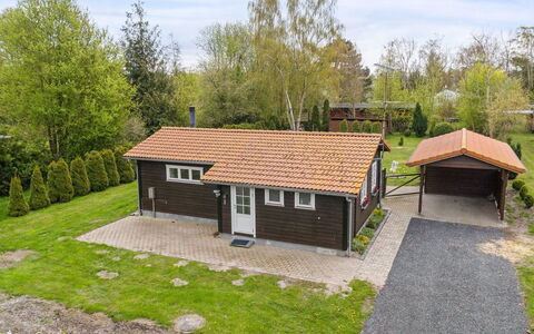 Undis - 660M from the Sea: Roof, House, Home, Cottage, Siding, Estate, Driveway, Garden Buildings, Yard, Shed