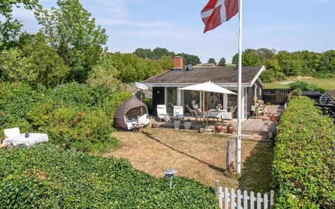 Daike - 25M from the Sea: Roof, Home, Siding, Cottage, Yard, Hardwood, Design, Garden Buildings, Wood Stain, Farmhouse
