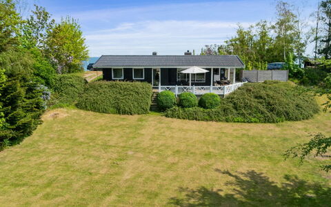 Arho - 75M from the Sea: House, Shrub, Home, Roof, Cottage, Estate, Farmhouse, Landscaping, Lawn, Porch