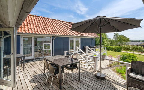 Edvia - 700M to the Fjord: Deck, Shade, Hardwood, Outdoor Furniture, Porch, Plank, Estate, Chair, Wood Stain, Design