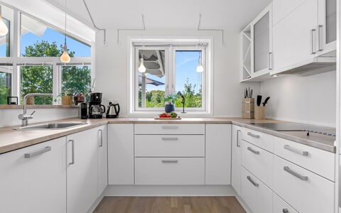 Skammel - 900M from the Sea: Kitchen, Countertop, Flooring, Kitchen Appliance, Interior Design, Wood, Cabinetry, Major Appliance, Floor, Ceiling