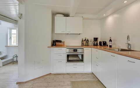 Gunulf - 150M from the Sea: Flooring, Countertop, Kitchen, Interior Design, Kitchen Appliance, Wall, Floor, Wood, Cabinetry, Major Appliance