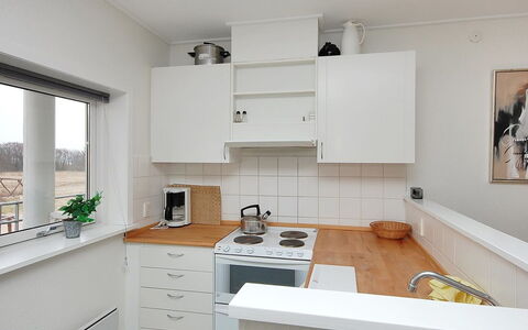 Enni - 100M from the Sea: Kitchen, Kitchen Appliance, Countertop, Major Appliance, Cabinetry, Flooring, Interior Design, Wood, Ceiling, Kitchen Stove