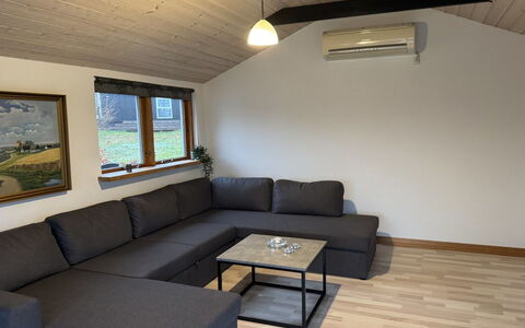Rafn - 550M from the Sea: Furniture, Couch, Flooring, Interior Design, Wood, Floor, Living Room, Room, Ceiling