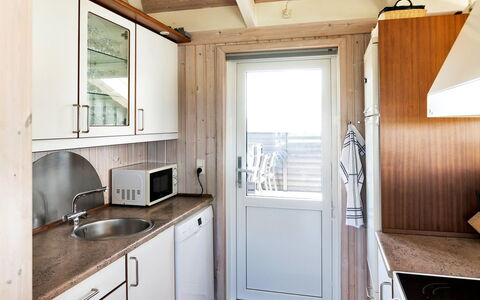 Elvie - 200M from the Sea: Wood, Flooring, Floor, Kitchen, Countertop, Interior Design, Door, Major Appliance, Sink, Cabinetry