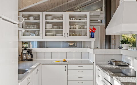 Otta - 779M from the Sea: Kitchen, Countertop, Interior Design, Cabinetry, Kitchen Appliance, Flooring, Ceiling, Major Appliance, Light Fixture, Furniture