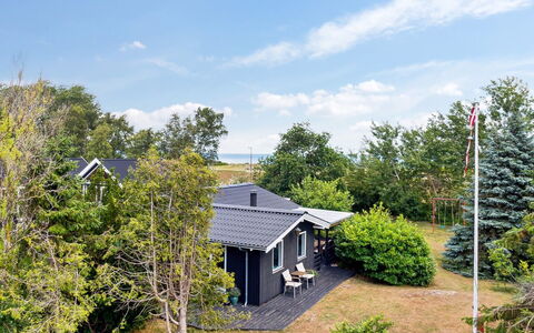 Margit - 10M from the Sea: Roof, House, Home, Cottage, Door, Siding, Estate, Lawn, Yard, Porch