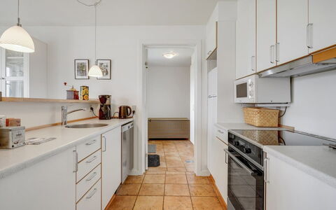 Askan - 200M from the Sea: Kitchen, Countertop, Flooring, Kitchen Appliance, Major Appliance, Interior Design, Cabinetry, Wood, Floor, Ceiling