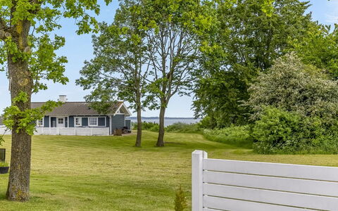 Ditte - 300M from the Sea: Lawn, Cottage, Shade, Fence, Garden, Landscaping, Siding, Home Fencing, Yard, Picket Fence
