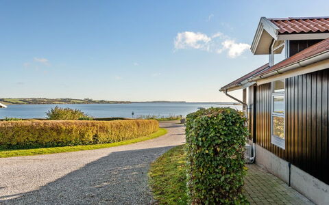 Nica - 100M from the Sea: Roof, House, Home, Cottage, Siding, Estate, Driveway, Garden Buildings, Yard, Shed