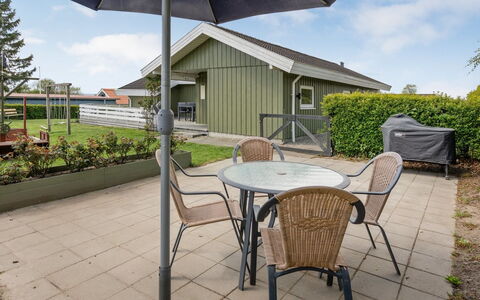Guldborg - 400M to the Fjord: Roof, Outdoor Furniture, Home, Shade, Cottage, Siding, Groundcover, Outdoor Table, Porch, Chair