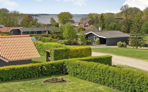 Guldborg - 400M to the Fjord: Grass, Shrub, House, Home, Land Lot, Garden, Roof, Lawn, Groundcover