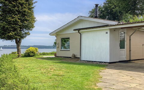 Launo - 150M to the Fjord: Roof, House, Home, Cottage, Siding, Estate, Driveway, Garden Buildings, Yard, Shed