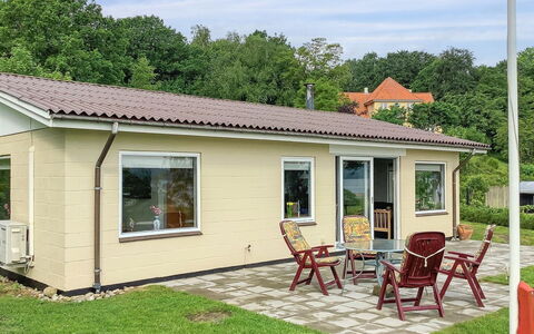 Launo - 150M to the Fjord: Roof, House, Home, Cottage, Siding, Estate, Driveway, Garden Buildings, Yard, Shed