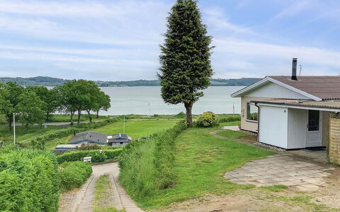 Launo - 150M to the Fjord: Roof, House, Home, Cottage, Siding, Estate, Driveway, Garden Buildings, Yard, Shed