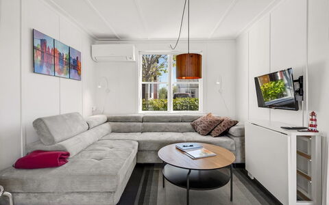 Milo - 5M from the Sea: Furniture, Interior Design, Couch, Flooring, Floor, Wall, Living Room, Wood, Room, Table